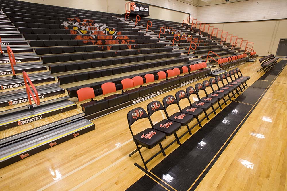 Telescopic gym seating in black and red